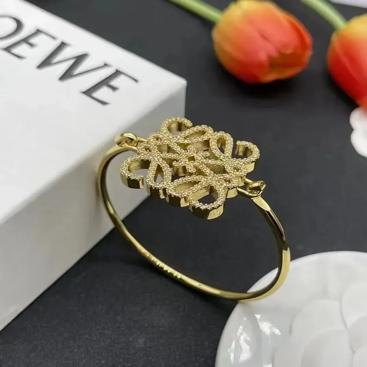 LOEWE Gold Bangle Bracelet with Floral Pattern Jewelry