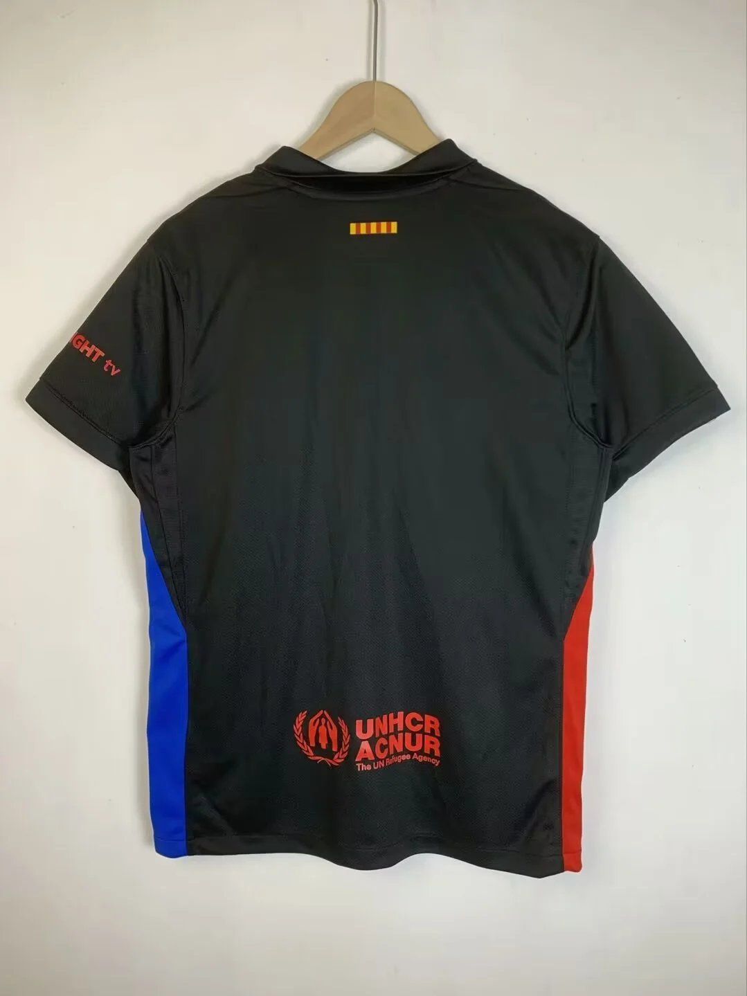 UNHCR Polo Shirt Black with Red and Blue Accents